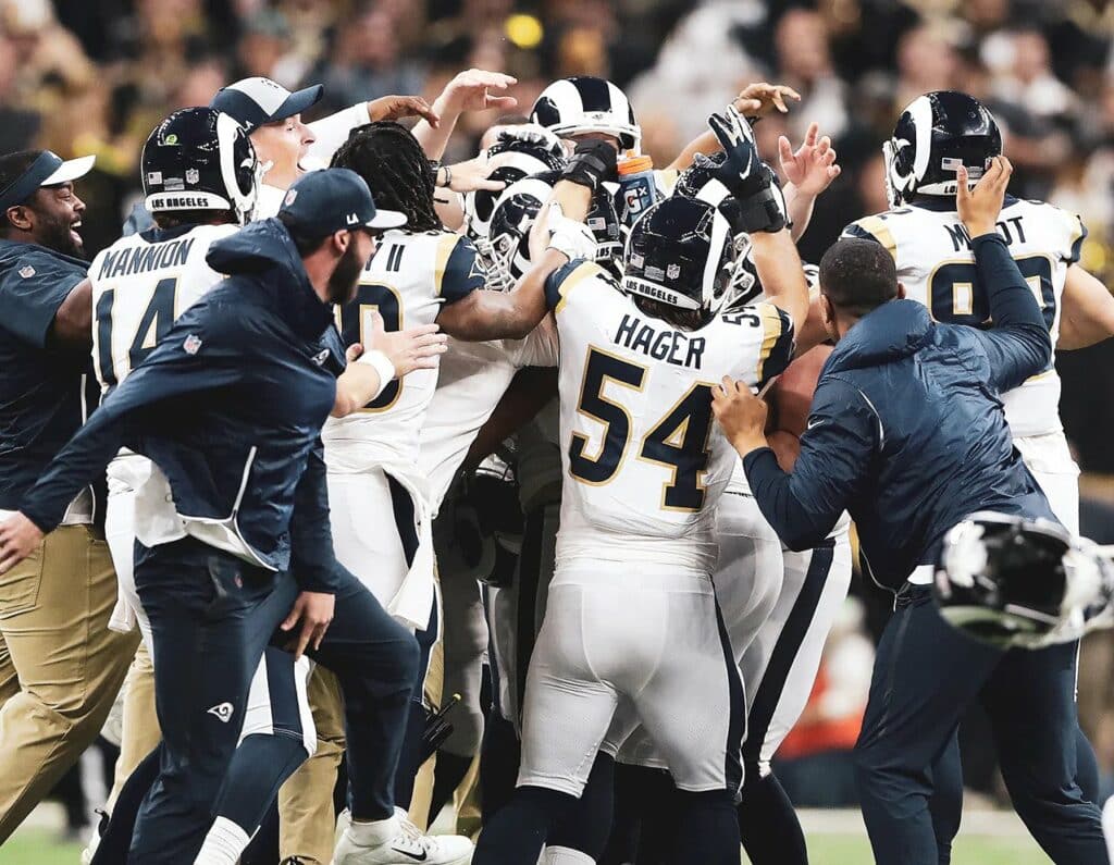 Football team celebrating on field
